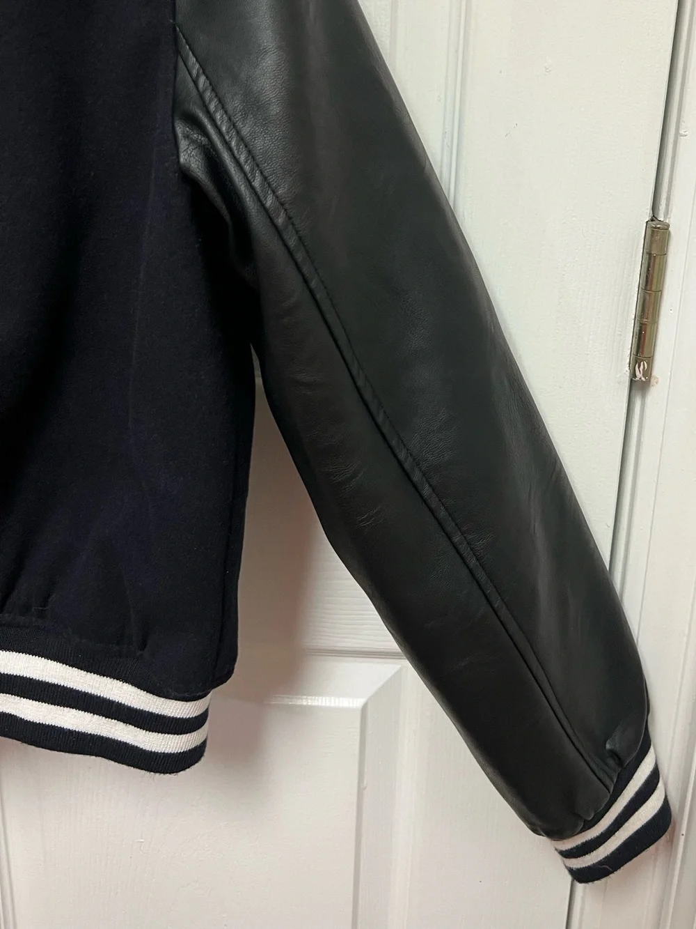 Levi Strauss & Co. Black and White Varsity Jacket with Vegan Leather Sleeves